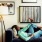 resident relaxes on the couch with her phone
