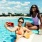 residents take a selfie in the pool