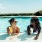 residents enjoy drinks at pool tanning shelf