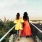 two woman walk to a lookout point over Washington, DC