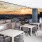 Rooftop patio with bbq area and fire pit overlooking the city with plenty of seating