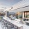 Rooftop patio with bbq area and fire pit overlooking the city with plenty of seating