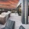 Rooftop patio with bbq area and fire pit overlooking the city with plenty of seating