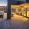 Rooftop patio with bbq area and fire pit overlooking the city with plenty of seating