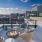 Rooftop patio with bbq area and fire pit overlooking the city with plenty of seating