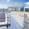 Rooftop patio with bbq area and fire pit overlooking the city with plenty of seating